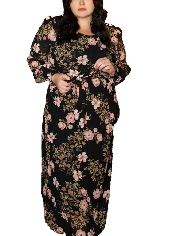 Front of a model wearing a size XL Bloom Maxi Dress Long Sleeves Floral Black in Black by ANNICK. | dia_product_style_image_id:282064